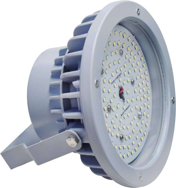 A circular, industrial LED flood light with a metallic gray casing and multiple small LED bulbs arranged in a circular pattern. The light has a heat sink with fins around its body and a mounting bracket at the base for installation.